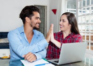 Young couple making online appointment succesfully